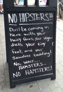 Sign outside restaurant making fun of vegans for their diets